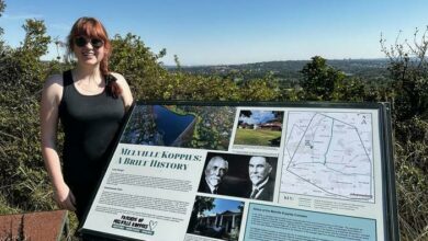 Caiti Gower and the new Melville history board