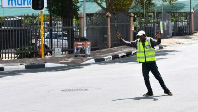 An informal pointsman directs motorists