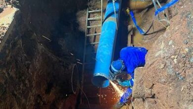 Workers install pipes to link the Hursthill 1 and Northcliff reservoirs.