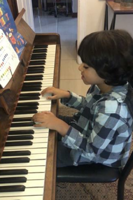 Zayn Cajee learns to play the piano.