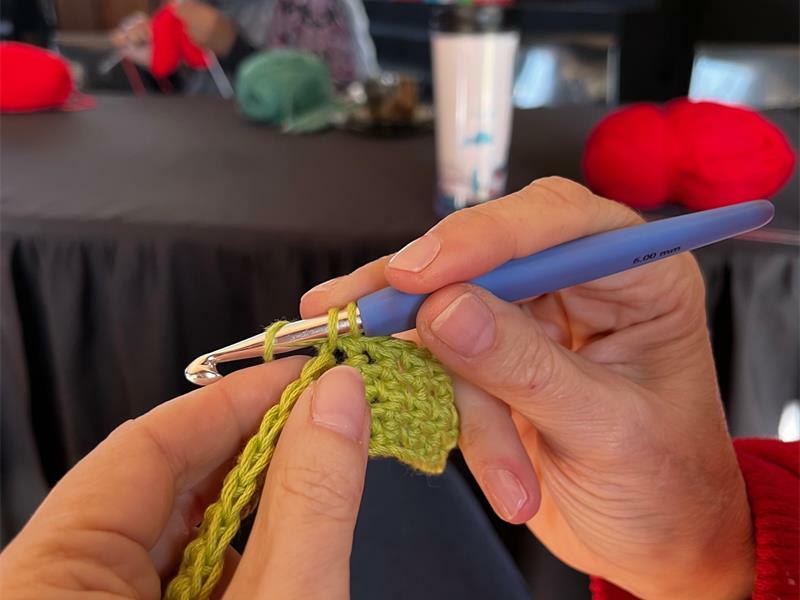 A winter item is being crocheted.