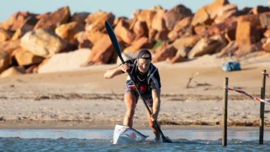 Bradley Boulle paddles into the water.