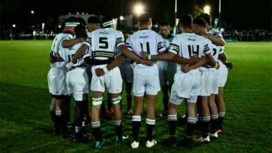 Hoërskool Linden rugby team huddles before the match.