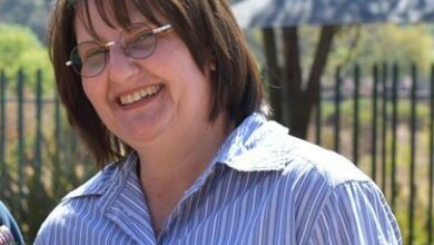 Linden CPF chairperson Annelize Tichauer planting seedlings at the Linden police station. Photo: Emily Wellman Bain.