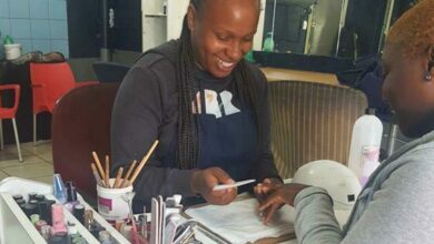 Dikeledi Moshupya does her client`s nails.
