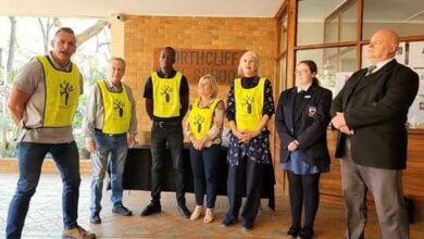 The Community Cleaners with Northcliff High School headmaster Walter Essex-Clarke who drew the winning tickets.