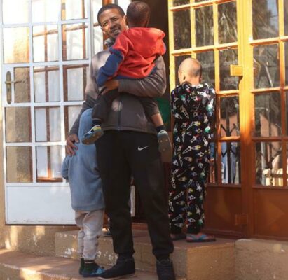 Larnell Mann with some children of the home. Photo: Neo Phashe