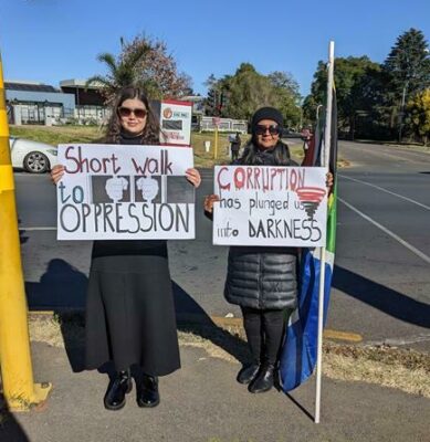 Nadia da Costa and Leila Mathias made protest signs for the demonstration. Photo: Emily Wellman Bain