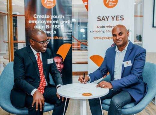 Professor Letlhokwa Mpedi from UJ and Ravi Naidoo sign the memorandum of understanding.