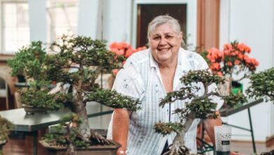 Erika Kohler with some of her bonsai. Photo: Neo Phashe