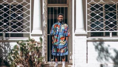 Fraynix at his Brixton home as he wears one of his designs. Photo: Neo Phashe