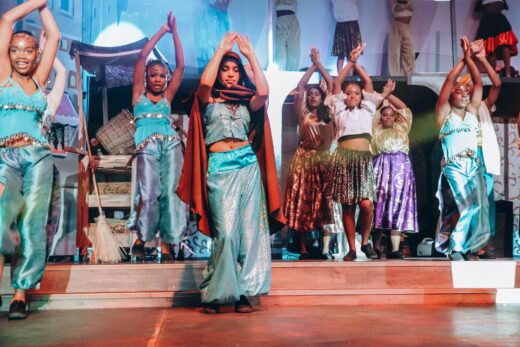 Cast members of Aladdin dance on stage. Photo: Neo Phashe