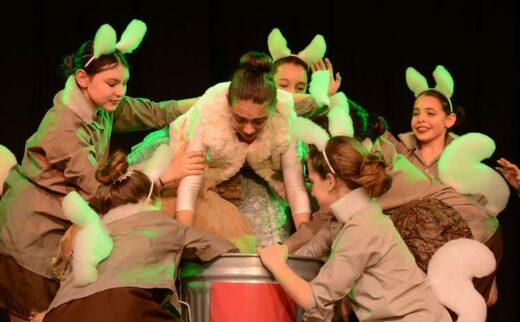 Playing the character of Veruca Salt, is Ariella Hurwitz. In this scene, she is being shoved done the 'bad' chute.