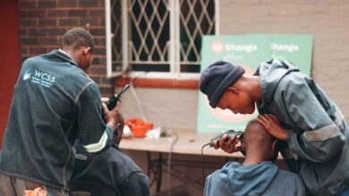 Volunteers from WCSS cut the hair of the displaced. Photo: Neo Phashe