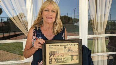 Carol Penny with a framed copy of her mother's article in the paper. Photo: Emily Wellman Bain