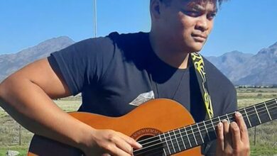 Daniel Raphels plays his guitar in a spectacular natural setting.