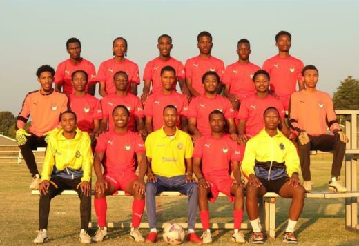 The Growing Champions soccer team. From left In yellow are coach Ashton Fernol, head coach Clive Letshaba and conditioning coach Lebohang Masiloane.