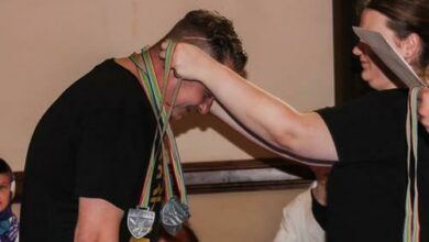 Morné van der Merwe receives his silver medals.