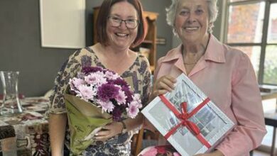 MHA Rose Village manager, Marcia Visser with former headmistress of Parktown High School for Girls, Pam Quinn with gifts given to them by the learners. Photos: Neo Phashe