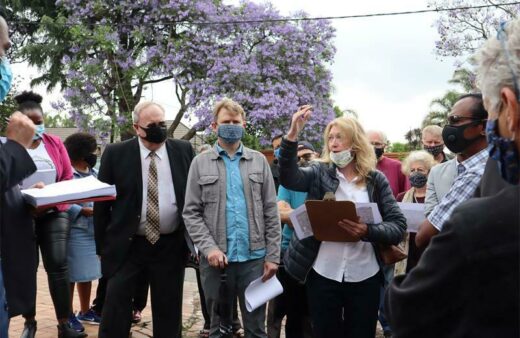 Gemey Abrahams attends an on-site building tribunal inspection.