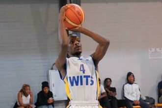 Ian Limbe plays basketball.