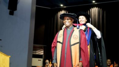 Dr Thebe Ikalafeng and UJ Registrar Prof. Bettine van Vuuren.