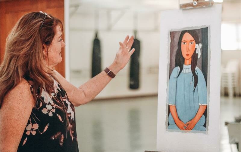 Noreen Beets critiques a students painting. Photo: Neo Phashe