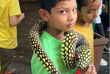 Shale Mahes dresses up as a snake.
