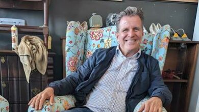 Hotel Hope founder Oliver Quambusch in a comfortable armchair for sale at Hotel Hope Interiors in Melville.