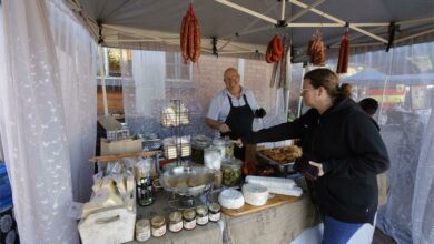Ernest Korkie and customer Veronique Stheeman who looks at getting some Baciami cheese, salami and seriously delicious pies.