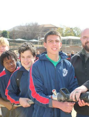 SCPs Juan van der Westhuizen and De La Salle learners got to spray some water with the firetruck hose.