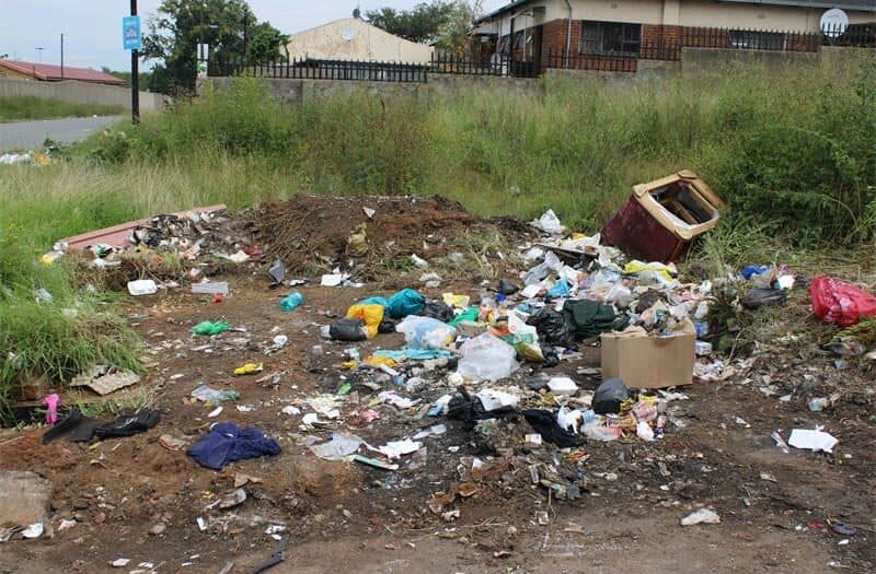 Decades of neglect have left Newclare's city-owned flats in disrepair, with crumbling infrastructure, overcrowding, and unpaid services worsening the crisis, leading to residents and local leaders calling for urgent action.