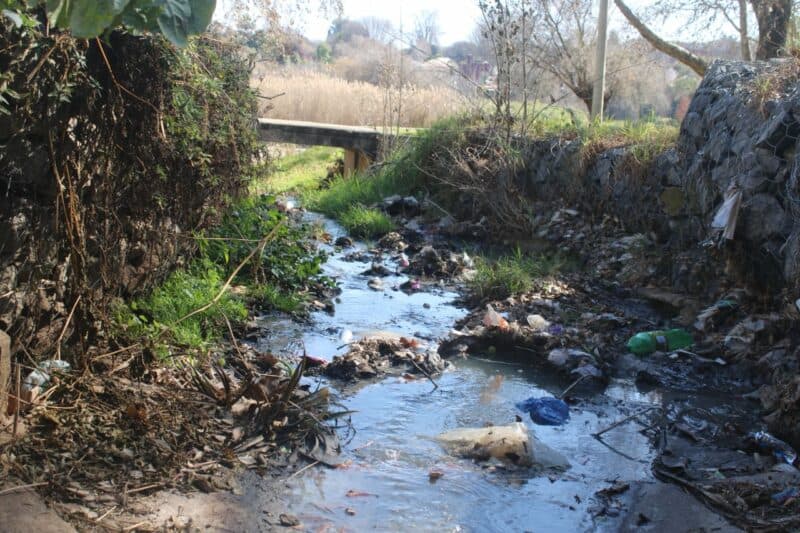 Overflowing drains, illegal dumping, and chemical runoff are turning this once-serene spot into a polluted shadow of itself.
