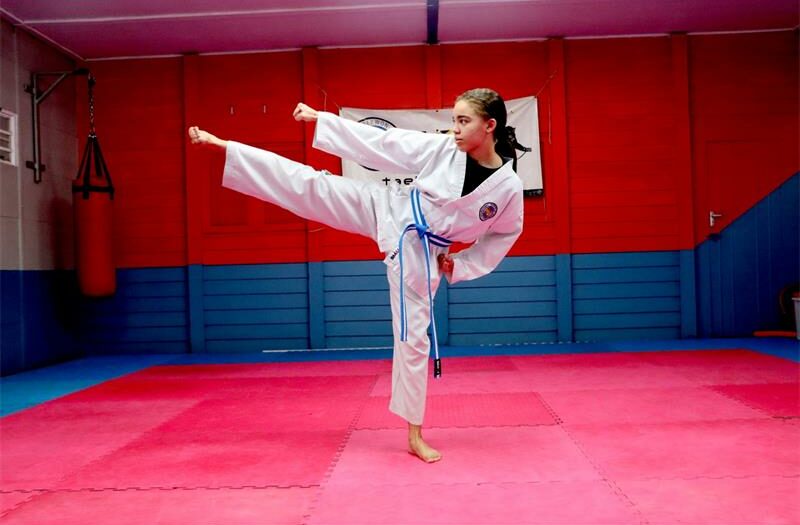 Taekwondo student Aza Ejimbe uses the sport to develop beyond the floor, learning discipline, control, and self-defense.