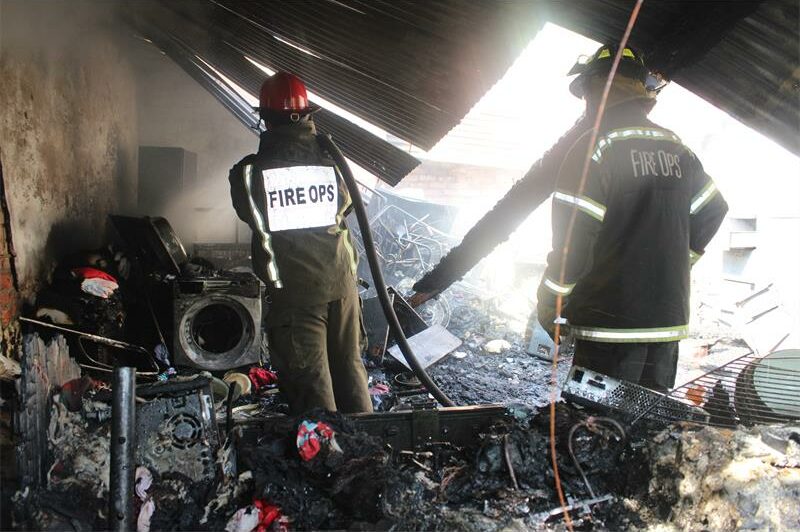 Firefighters faced locked garage doors and intense flames in East Town, but managed to control the fire within 45 minutes.