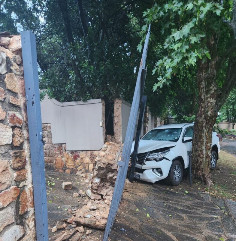 The first rains of the season turned Lily Road into a hazard zone today, with a vehicle skidding off a bend and crashing into a wall.