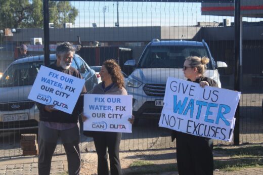 Ahmed Kathrada Foundation Executive Director, Neeshan Bolton, alongside WaterCAN Executive Manager, Dr Ferrial Adam, and JoburgCan Manager, Julia Fish, protest in 2024 over water shortages in Westdene on November 27, 2025. Photo: Waydon Jacobs