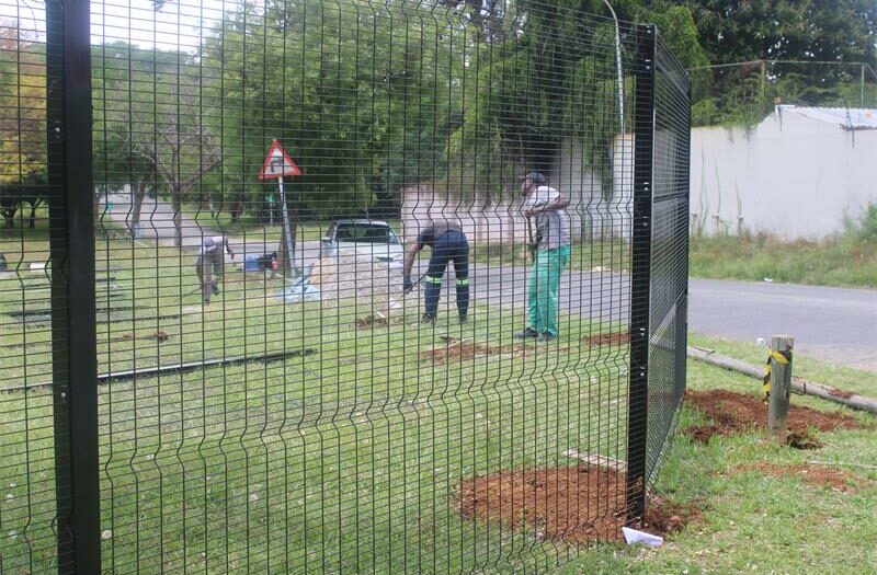 The community's persistence pays off as the construction of the park fence will transform a neglected green space into a cleaner, safer and more welcoming environment.