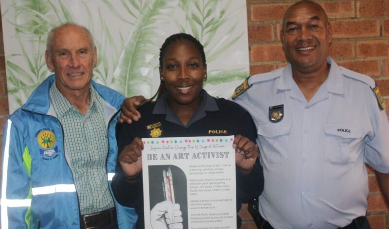 Linden Sector 2 chair Geoff Shute, Constable Prudence Tshabalala and Warrant officer Azwinnfini Nevhuhulwi show the art activist poster for the 16 Days of Activism at Linden SAPS on November 04, 2025. Photo: Waydon Jacobs
