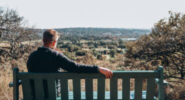 Riaan Janse van Rensburg sits on a bench that overlooks Emmarentia on May 20, 2023, at the Melville Koppies nature reserve and heritage site. Photo: Neo Phashe