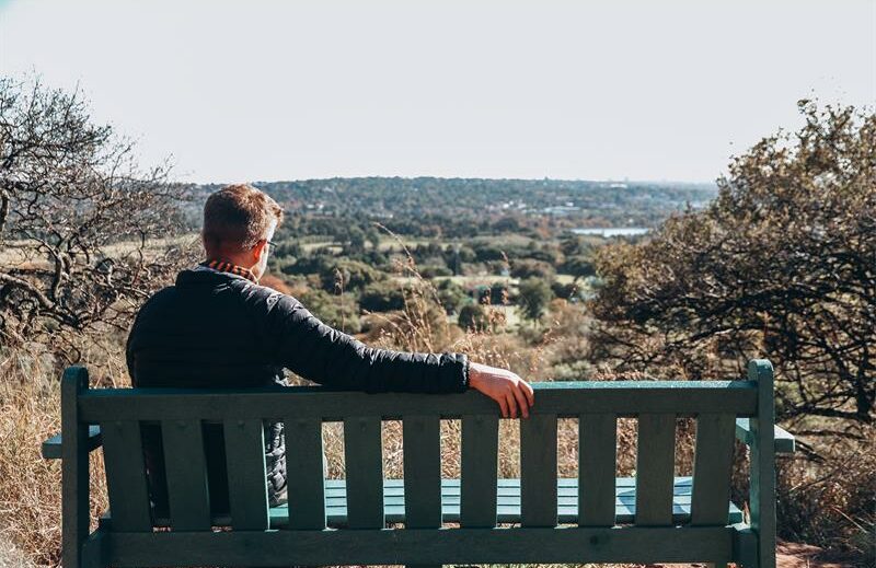 Riaan Janse van Rensburg sits on a bench that overlooks Emmarentia on May 20, 2023, at the Melville Koppies nature reserve and heritage site. Photo: Neo Phashe