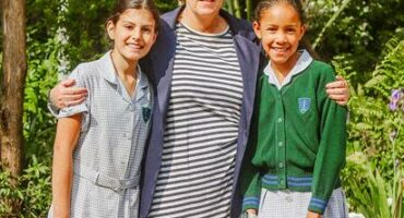 Joanne Glendinning stands on a life-sized chess board flanked by learners on September 9, 2025, at Auckland Park Preparatory School. Photo: Neo Phashe
