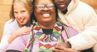 Matron of Marang House Salome Parkies flanked by children in the home on September 27, 2025, at Marang House. Photo: Neo Phashe