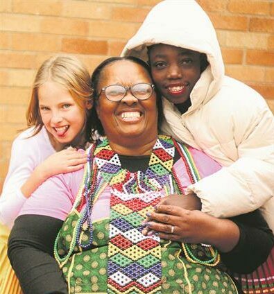 Matron of Marang House Salome Parkies flanked by children in the home on September 27, 2025, at Marang House. Photo: Neo Phashe