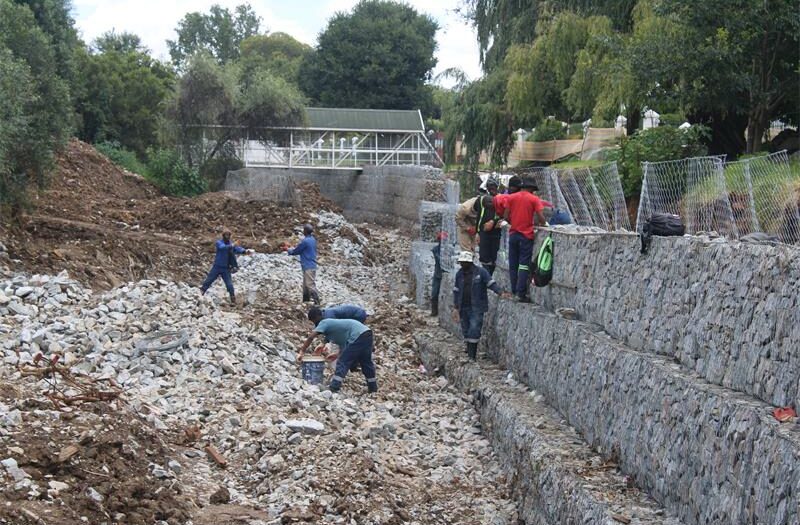 Work has resumed on the Fairland Estate gabion storm water project after a lengthy standstill. Residents highlight ongoing improvements, while JRA confirms all contractor payments have been addressed and the project remains scheduled for completion in March, promising enhanced flood protection for the estate.
