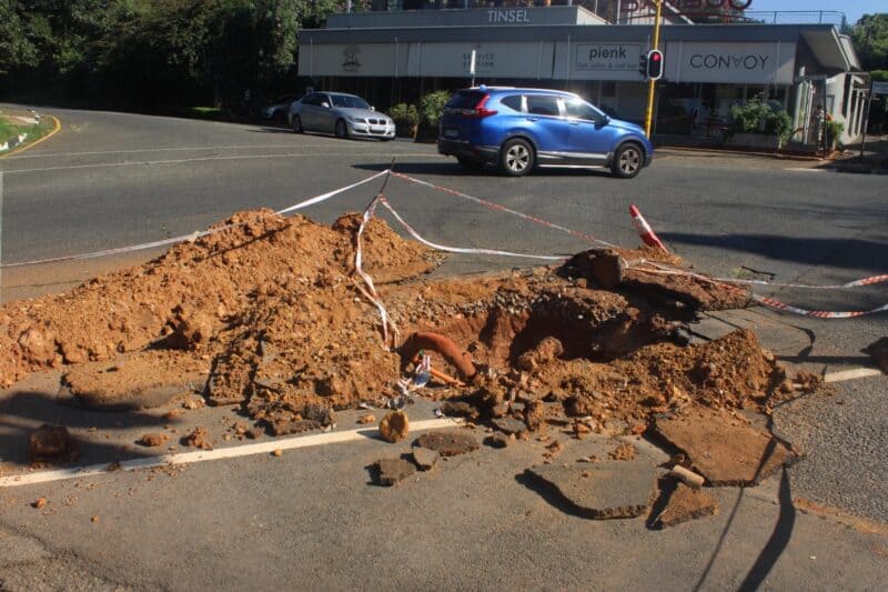 An open excavation on Rustenburg Road has been there for weeks, with uncertainty over repairs and mounting pressure on city entities to act.