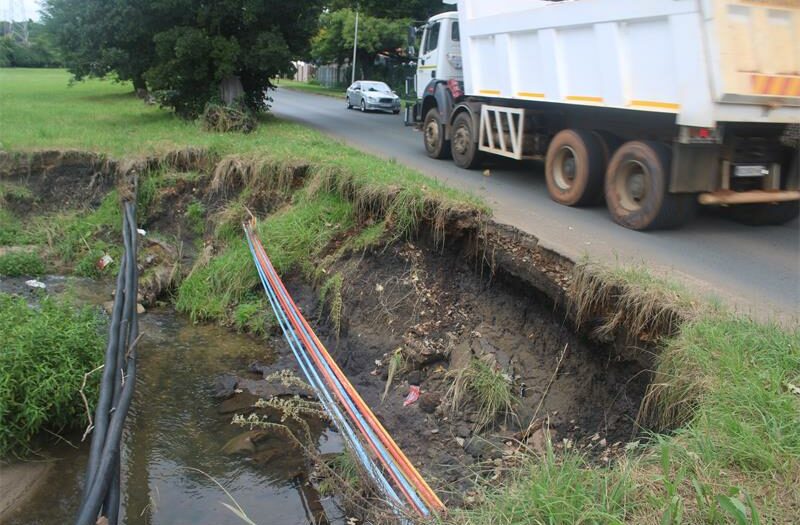 Preliminary inspections traced the erosion to overgrown trees blocking water flow.