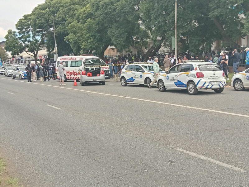 A collision spiralled into a deadly confrontation, leaving a man dead and his wife fighting for her life as authorities close off the area and urge motorists to steer clear.