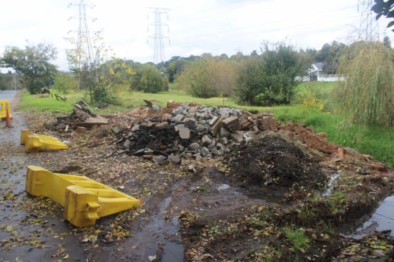 Residents still wait for answers as a once-dangerous washout site on Hofmeyer Drive shows changes, but remains incomplete.