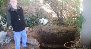 Albertsville resident Alex Voxcroft shows the abnormal root structure that damaged his sewage system on June 7,2026. Photo: Waydon Jacobs
